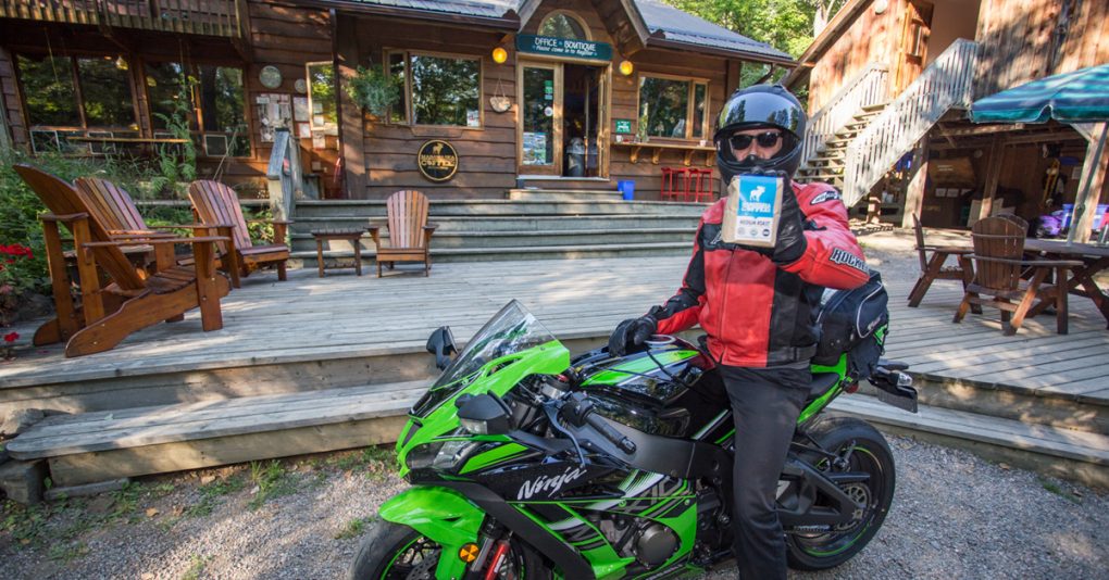 Biker holing his Madawaska Coffee
