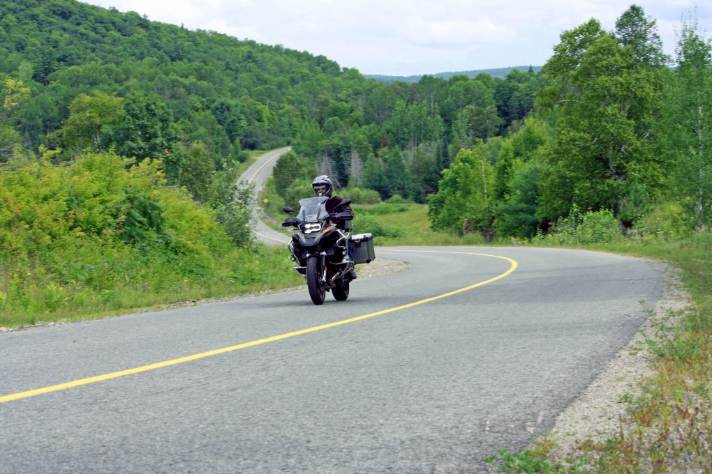 Man on motorcycle on twisty road