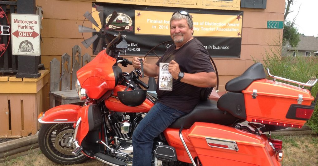 Costumer on motorcycle outside of the Country Cupboard