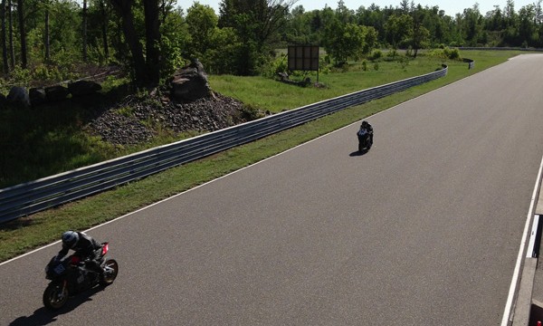  Two motorcycles riding on Calabogie Motorsports Park track 