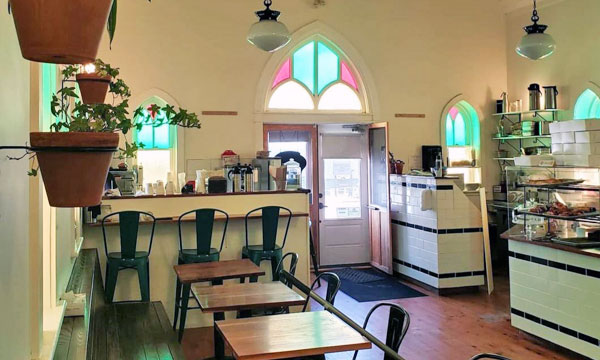  Interior of cafe in a church with stain glass windows