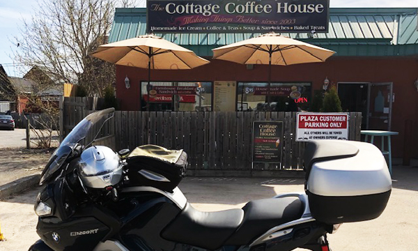 Motorcycle in front of Cottage Coffee building