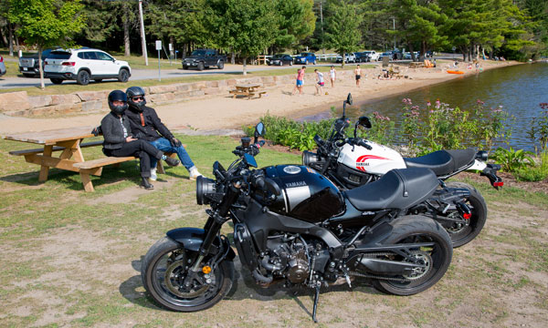 Two motorcycles by beach