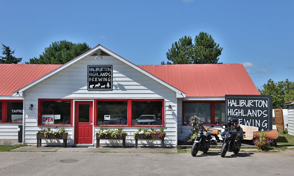 Motorcycle in front of Haliburton Highlands Brewing Sign