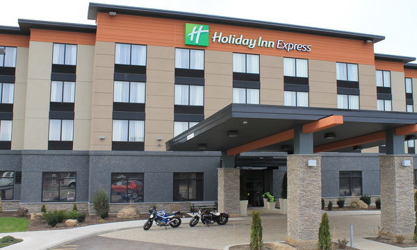  Holiday Inn Express brown building with 2 motorcycles sitting in front